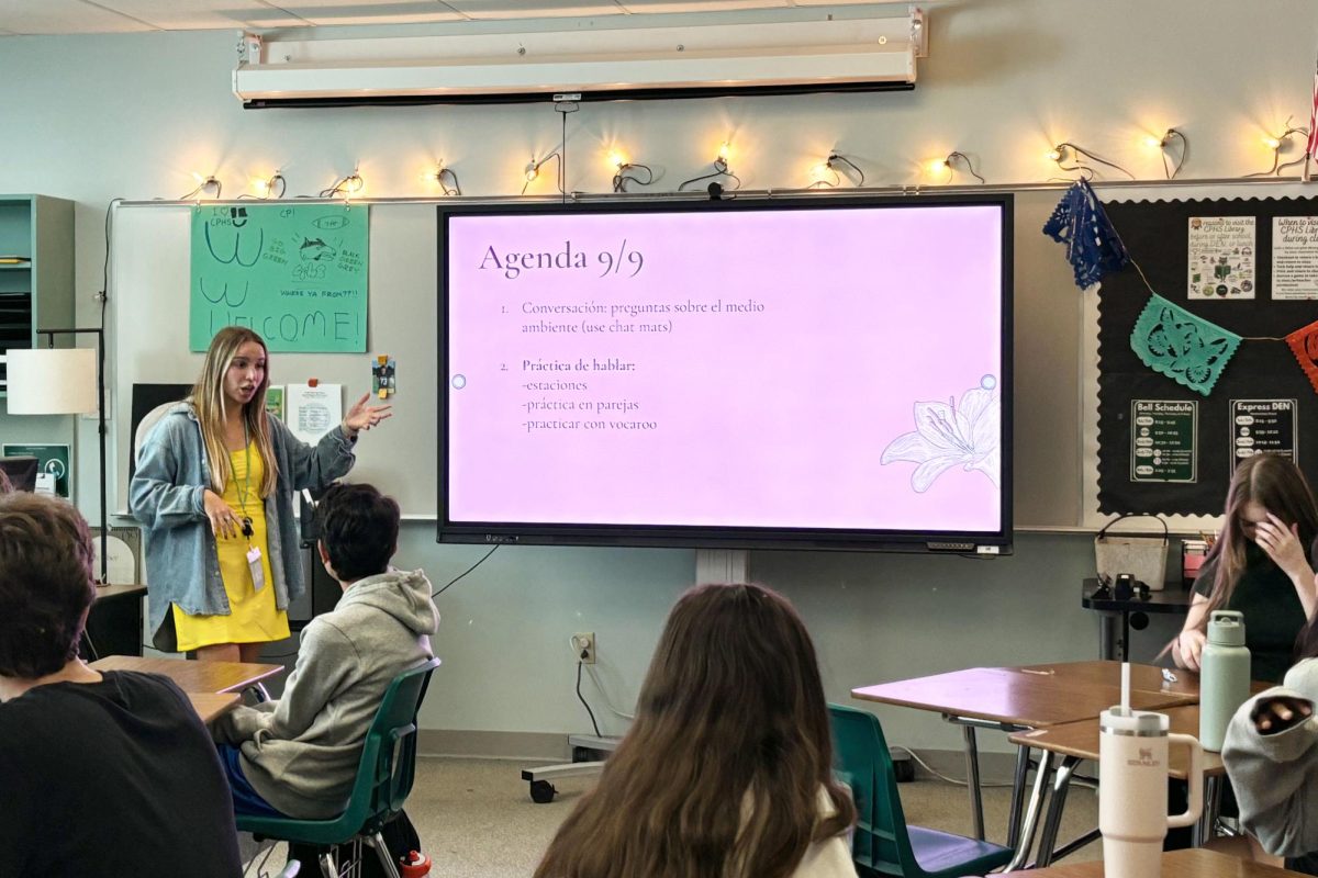 With her daily agenda displayed on the new interactive panels, advanced spanish II and III teacher Sofia Pickle explains to her students their tasks for the day. The new interactive panels come with many features including the ability to annotate directly on the board.“I do love the that I can display certain spanish vocabulary or spanish conjugation [on the panels],” advanced spanish II and III teacher Sofia Pickle said. “I can go and write underneath it or take notes directly on those words or the worksheet I have displayed. I really enjoy that the panels are accessible and have features that are fun for students.” Photo by Alyssa Fox