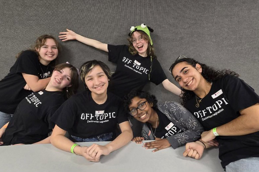 Smiling, the Destination Imagination team poses for a picture together. The team placed seventh at global finals in Kansas City, Missouri in May. “This is the second time I’ve gone to global finals, and it’s always such a great experience,” sophomore Aryana Jahadi said. “I’m really happy and super privileged to have been able to experience it twice now. Being able to do better than last time and get seventh was an amazing feeling.”