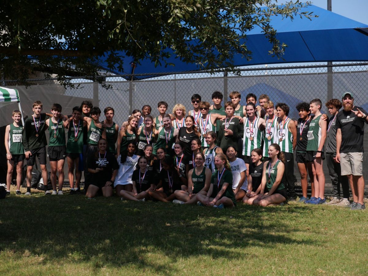 The cross country team poses for the camera after finishing the district meet. The varsity boys, JV boys and JV girls all placed third and the varsity girls placed fourth. “Coach put in the right training for us for this season, so I think we will be peaking this week and the next couple of weeks,” varsity runner and junior Nathan Kukla said. “The chances of making it to state are very high, but we don’t settle for the lowest and there is always going to be that chance, so [we] race for the best.”