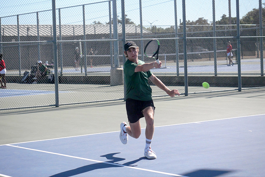 Swinging with his arm extended, senior Nolan Park hits the ball smoothly over the net and to the opponent’s side. Park is one of four varsity tennis captains and helped the team win district championships. “Winning district champs was a pretty awesome feeling,” Park said. “We had lost to Liberty Hill a couple of weeks before, but when we played them [again], we came out and really took care of business. We took them out and it was just a really awesome night.”