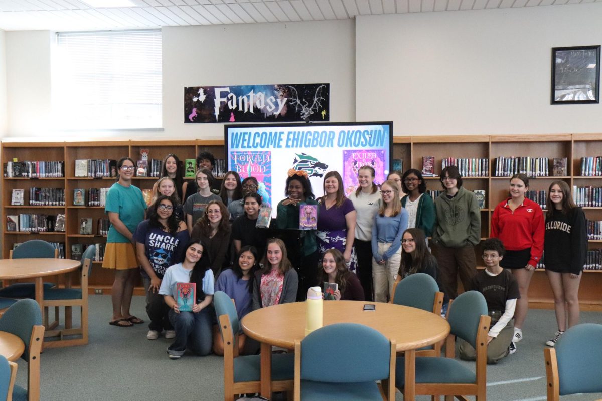 Smiling at the camera, Author Ehigbor Okosun, members of Page Turners, and other students reflect on the author's visit. “I thought the visit was great,” Senior Amia De Leon said. “It was interesting talking to her and [getting to know] her process and her thoughts and books in general. But I think the reason it went well [was that] people got to ask questions. I'm glad that she said so much in response to the questions and it wasn't just one and done. [The author’s responses] felt very articulate.”