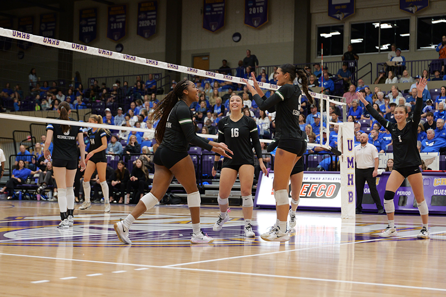 Junior outside hitter Joy Udoye celebrates with senior middle Sofia Peters after a point.