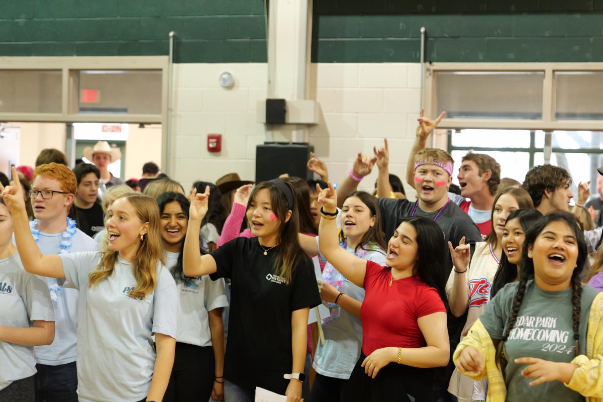 As one of many leading a group of eighth graders through the halls of CPHS, junior Jaya Philipose helps introduce the future T-Wolves to their new school during 8th Grade Invasion. As a member of PALS, she guided tours and shared her experiences to help incoming students feel at home. "It was so awesome to welcome the next class of T-Wolves," Philipose said. "I remember my own 8th Grade Invasion and how kind PALS were. I feel so blessed to have had that full-circle moment and hopefully made the same impression on them." Photo by Alyssa Fox