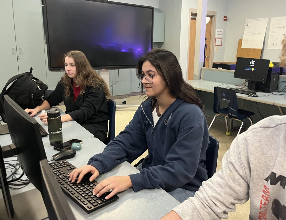 Typing away on her computer, junior Stephanie Manoel works on an assignment for her cybersecurity class. Being involved in DECA, which requires students to take CTE course, and having taken Computer Science I in her freshman year, this was the first course Manoel considered as she already felt familiar with the environment. “I’d definitely recommend this class to anyone interested in pursuing computer science or cybersecurity,” Manoel said. “The workload is manageable, but still gives you the knowledge you need. Overall, it’s the environment that keeps me motivated to come to class every time.”
