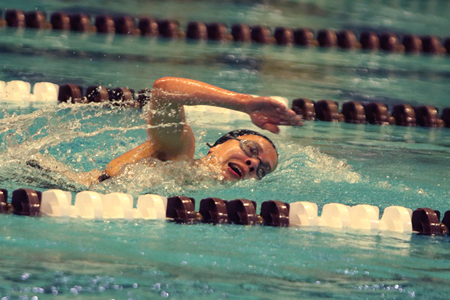 Bringing her arm over her head and taking a quick breath, junior Lauren Lucas swims the final laps of the 500 freestyle at the regionals swimming competition on date. Lucas broke the school’s 18-year-old record for the 500 freestyle at regionals and again at state with a time of 4:58.63. “I’d had my eye on that 500 record since my freshman year, so I was really excited to see if I could get it at regionals or districts,” Lucas said. “ State is always a really fun experience and medaling for the first time was really great. It was a very very tight race, [so] I was a bit surprised [that I medaled]. [There were] a lot of fast girls at the meet in general, [and] it was like a dogfight back and forth, back and forth.” Photo by Kaydence Wilkinson