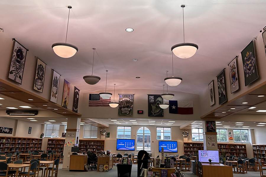 Lined up along the wall, the class banners from previous graduating classes are displayed in the library. The banners will be moved to the cafeteria, but librarian Keri Burns said she enjoyed the school spirit they brought to the library. “For visitors and non-students, [the banners] are just a nice glimpse to get a little piece of what it was like at that time or what was important to them,” Burns said. “It's like a little visual time capsule.”