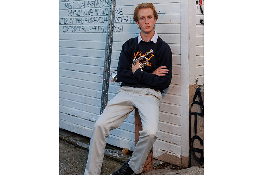 For his senior photos Harrison Whitfield poses with his trumpet. Whitfield expressed his love for music and how it came to be in America. “It’s just so cool to me the piano and the organ came from Europe and then more rhythmic stuff like drums came from Africa,” Whitfield said. “They met through unfortunate circumstances, through the Middle Passage and like Triangle Trade, like these really tragic events, but people bonded over music and created new genres once they reached America.” Photo courtesy of Ralph Gonzales.