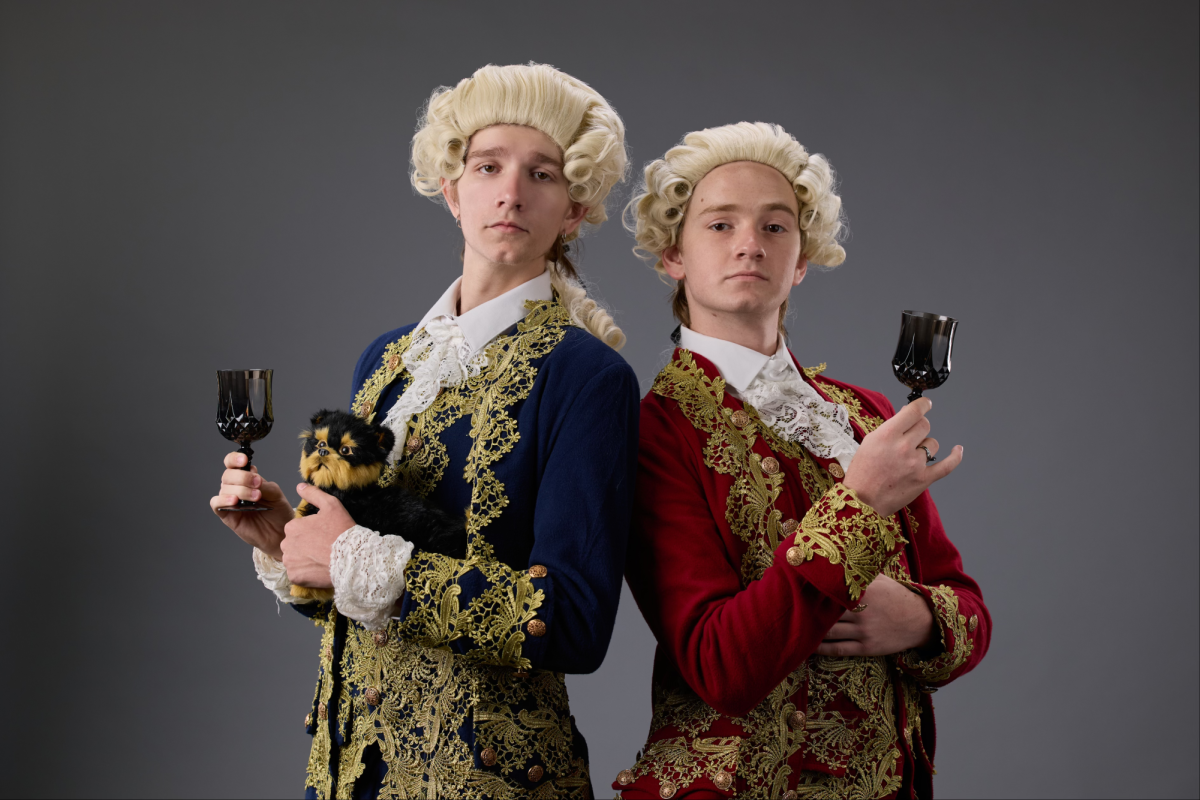 Dressed in colonial attire, Seth Loudeslager and Evan Schmitt pose for their senior theater photo. These two 
 have been friends since middle school, and found a shared love of theater, history and comedy.  Schmitt will be heading to The State University of New York to pursue a degree in performing arts, while Loudenslager will be going to ACC before transferring to a four year college to pursue Pre-Med. Photo Courtesy of Danielle Walker