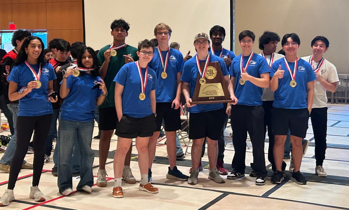 Posing with their UIL State Trophy, the Robolobos Van Halen Team beams with excitement after their win. “It was a team effort,” junior Noah Vo said. “I was happy because something happened in the first match and the match was also really close. So [when] they finally revealed it, I was pretty happy.” Photo courtesy of Amy Lovelace
