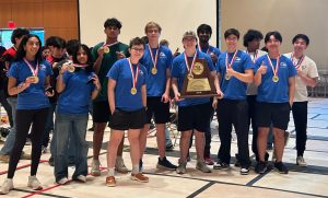Posing with their UIL State Trophy, the Robolobos Van Halen Team beams with excitement after their win. “It was a team effort,” junior Noah Vo said. “I was happy because something happened in the first match and the match was also really close. So [when] they finally revealed it, I was pretty happy.” Photo courtesy of Amy Lovelace