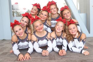 Piled on top of each other with bright smiles, cheerleaders from the Tech Cheer Gunsmoke team, including senior Macy Alexander, pose for a picture. Alexander has been cheering since she was three years old and is currently on the high school cheer team as well as the Tech Cheer Gunsmoke team. “As someone who’s cheered their whole life, I’ve learned what it’s like to be a teammate and to be someone that’s there for their other teammates and know that I always had people to go to if I needed something,” Alexander said. “We know when it’s the right time to joke around, but we also know we have a goal, and by the end of the season that goal is consuming our brains and having to work together has always been an important aspect. You’re not doing it for yourself, you’re doing it for everyone around you.”
Photo Courtesy of Macy Alexander