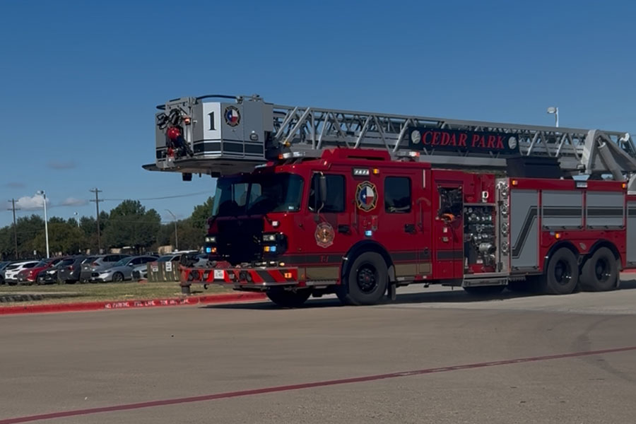 The fire department came to the school after students were evacuated when smoke started coming from the ceiling of a classroom. All students and staff are safe. “All of my friends left their stuff too, so we couldn’t contact our parents, and it was stressful,” senior Brynn Fowler said. “It was scary because I didn’t know [what was going on], and I couldn’t find anyone because it was a big crowd.” Photo by Anthony Garcia
