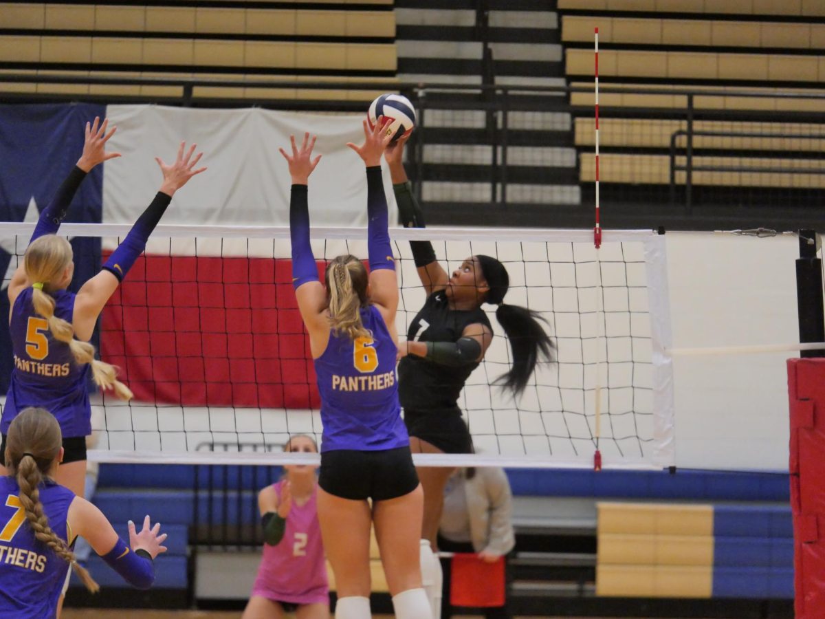 Swinging her arm powerfully, senior outside hitter Joy Udoye hits the ball over the net. Udoye, who will play for Stanford next year, is one of four Division I commits for the varsity volleyball team. “My friends here are literally like my sisters for life,” Udoye said. “It’s going to be so sad leaving everyone, but I’m so excited to see what I can do next year.” 
