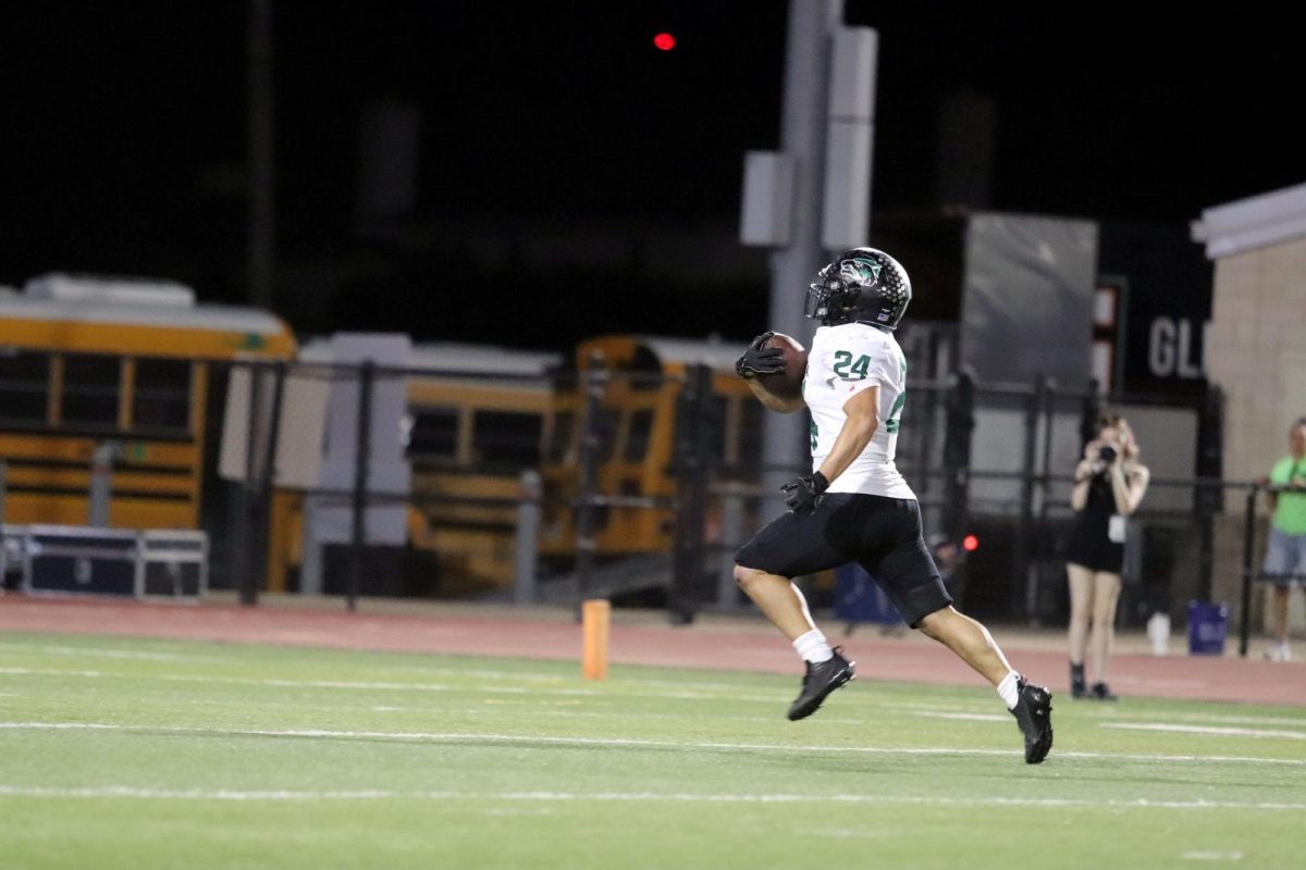 Running for the end zone, junior running back Lucas Viloria breaks free for a touchdown in the game against Glenn Friday night. Viloria rushed for two touchdowns in the 52-28 win. “It was a great confidence booster,” Viloria said. “It sets us up for the next game and shows the rest of the district what’s going to happen next.” 