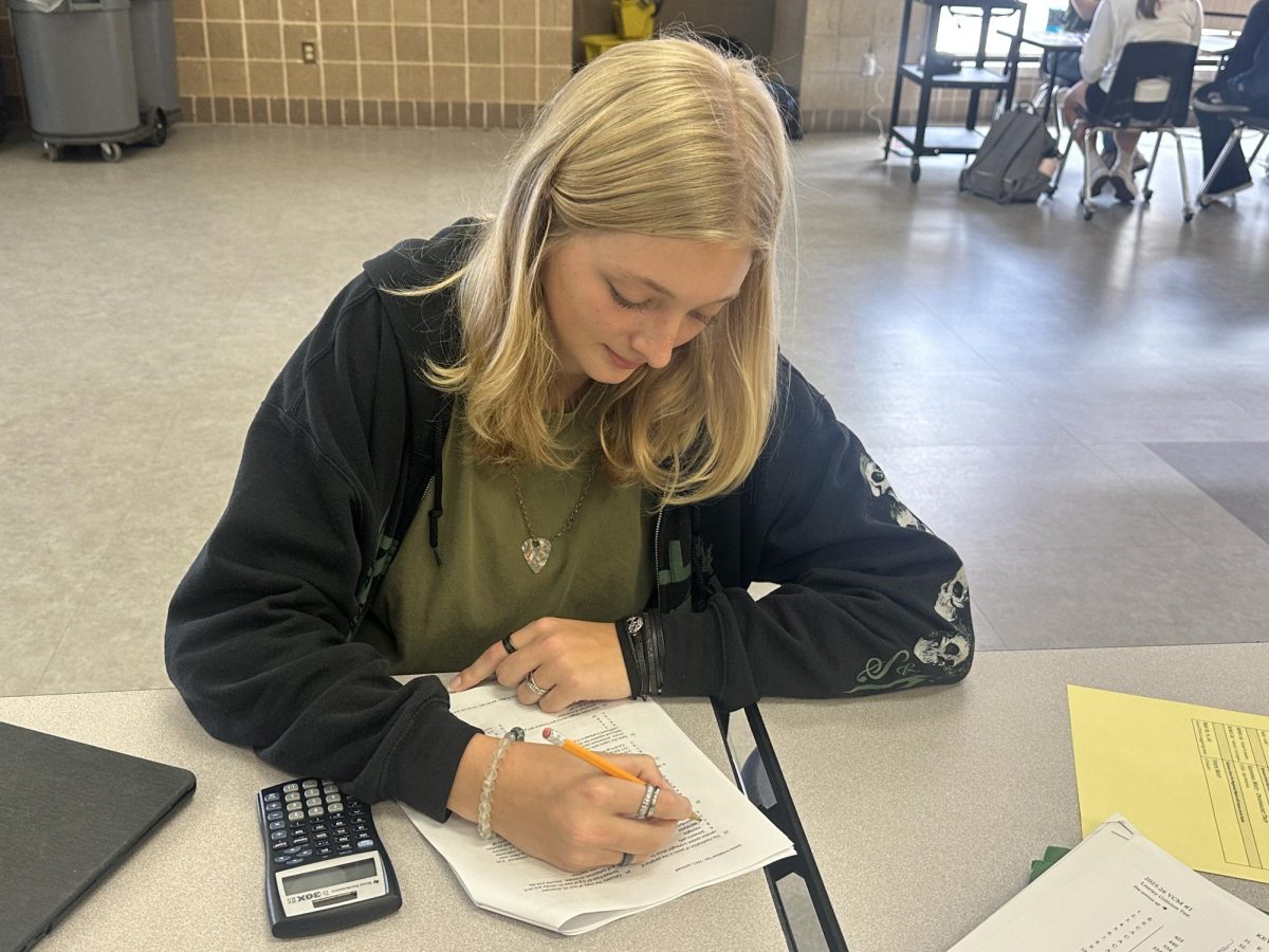 Holding a pencil, junior Calista Davis studies for a test. Davis recently achieved a perfect score of 36 on the ACT. "I think my best advice would just be to do the practice tests,” Davis said. “They’re the most valuable resource you can really use, and they were really helpful for me."