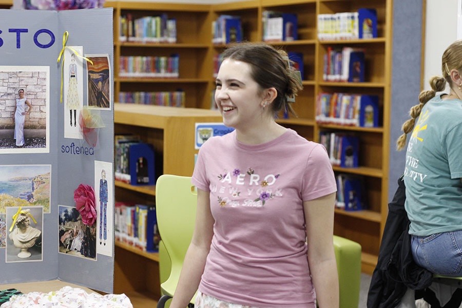 Smiling in front of her display, junior Adalyn Ables represents the Fashion Design course at a Career and Technical (CTE) fair hosted at the middle school. The fair was an all-day event and took place on Nov. 19. “I'm happy that I am able to present fashion because it's fun to talk about what I've done in this class, explain what's fun about it, encourage other people and make them feel like they want to join it,” Ables said. “It's also nice that every single CTE class is here together because it shows all the different routes you can take.”