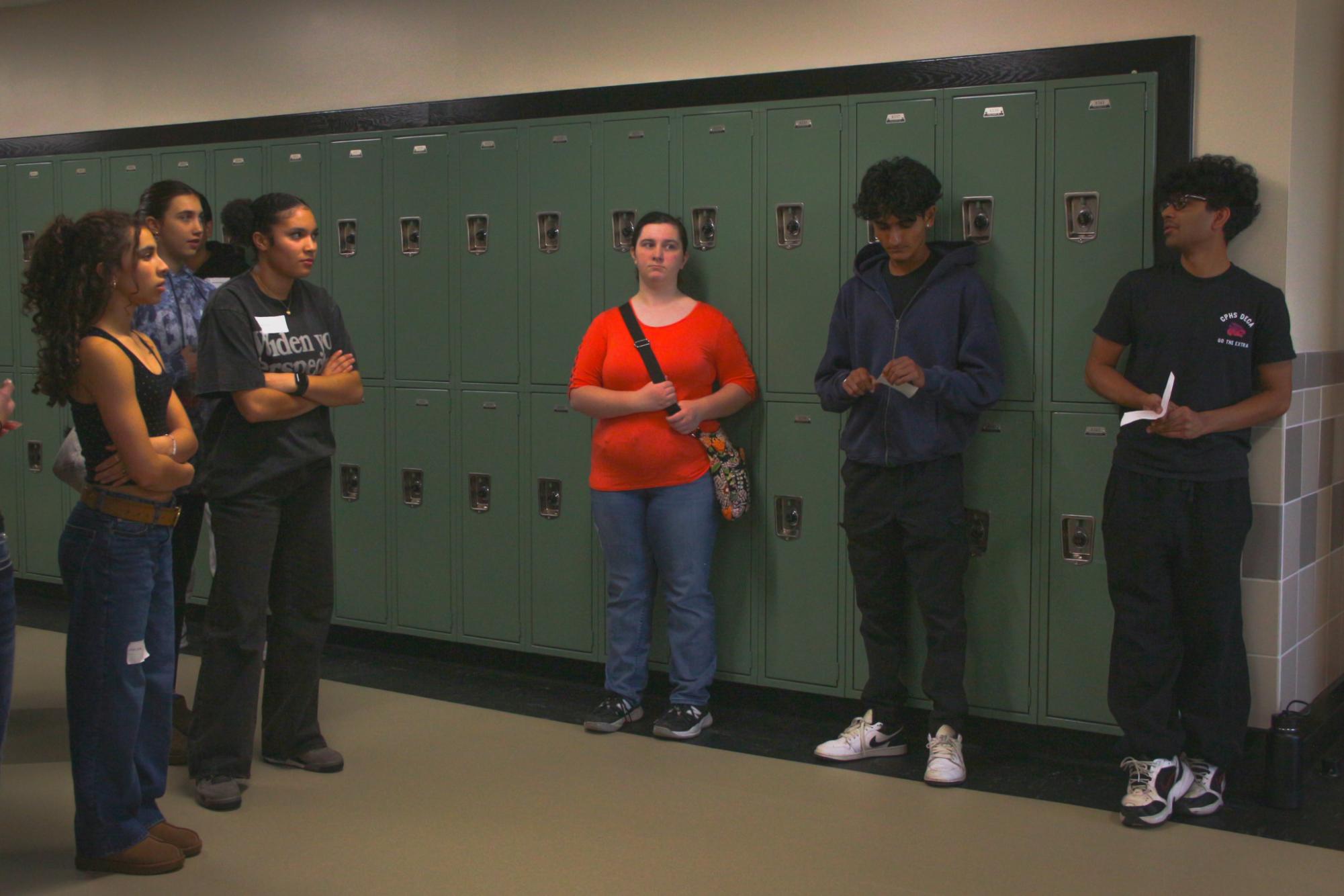 8th graders gather in the hall to listen to Deca talk about classes in high school. Deca students received volunteer hours for helping in the event. “My favorite part is seeing so many new faces and getting to see who is going to join us next year.” Sophomore DECA student Meera Palsikar said. “Especially because I was there before when I was in eighth grade.”
