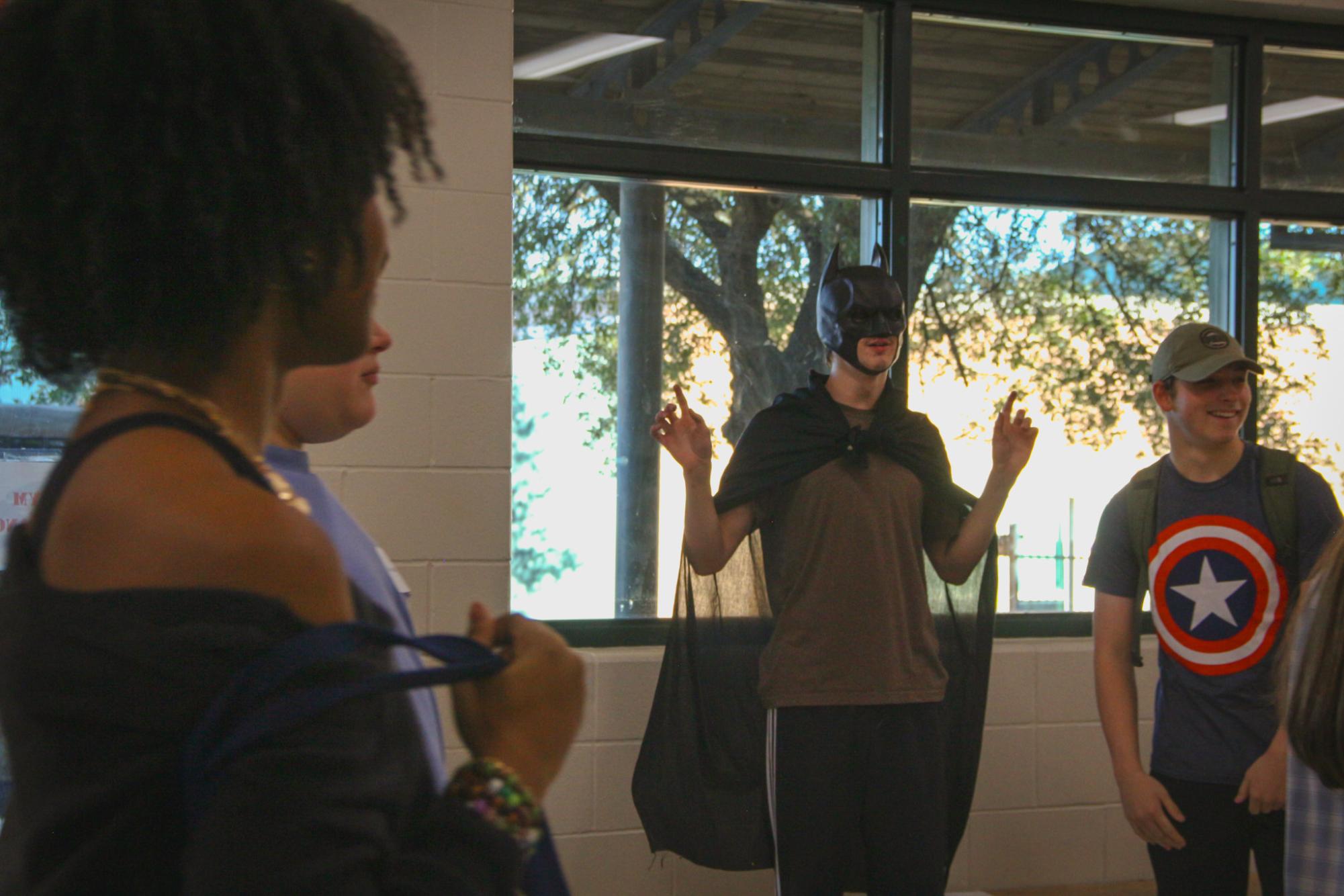 Senior Everett Taylor, dressed as Batman, scopes out the future freshman. Taylor was one of the many members of PALS who were there to greet and guide the middle schoolers. “I’m just glad that I get to skip school,” said 8th grader Deacon Johnson. “I don't really like school.”