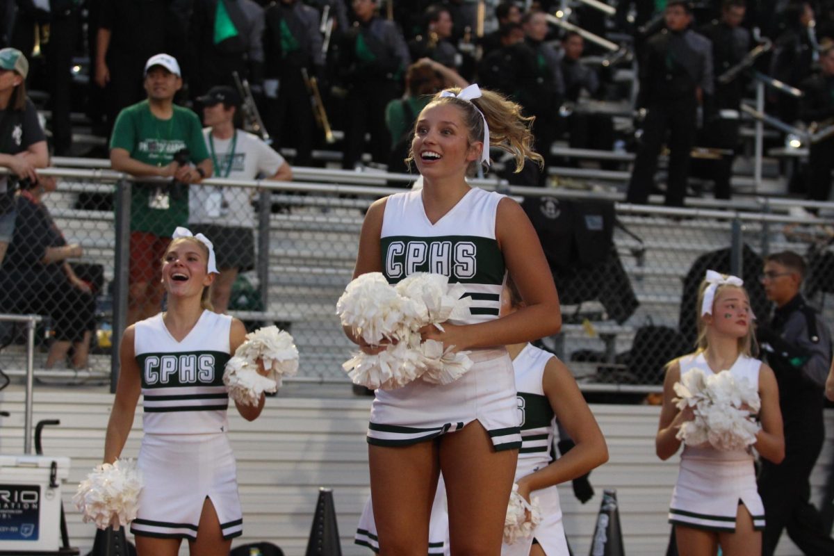 Cheering at the football game against Vandegrift on Sept. 5, senior cheer team captain Katie Foster yells her chants alongside the rest of the cheerleaders. The cheer team is going to compete at the Fort Worth Convention Center for the UIL State Spirit Championships. “As a leader, I know just how hard the team works each and every practice,” senior cheer team captain Katie Foster said. “Personally, I have tried to take on every moment with gratitude because I know as a senior we don’t get another chance.”