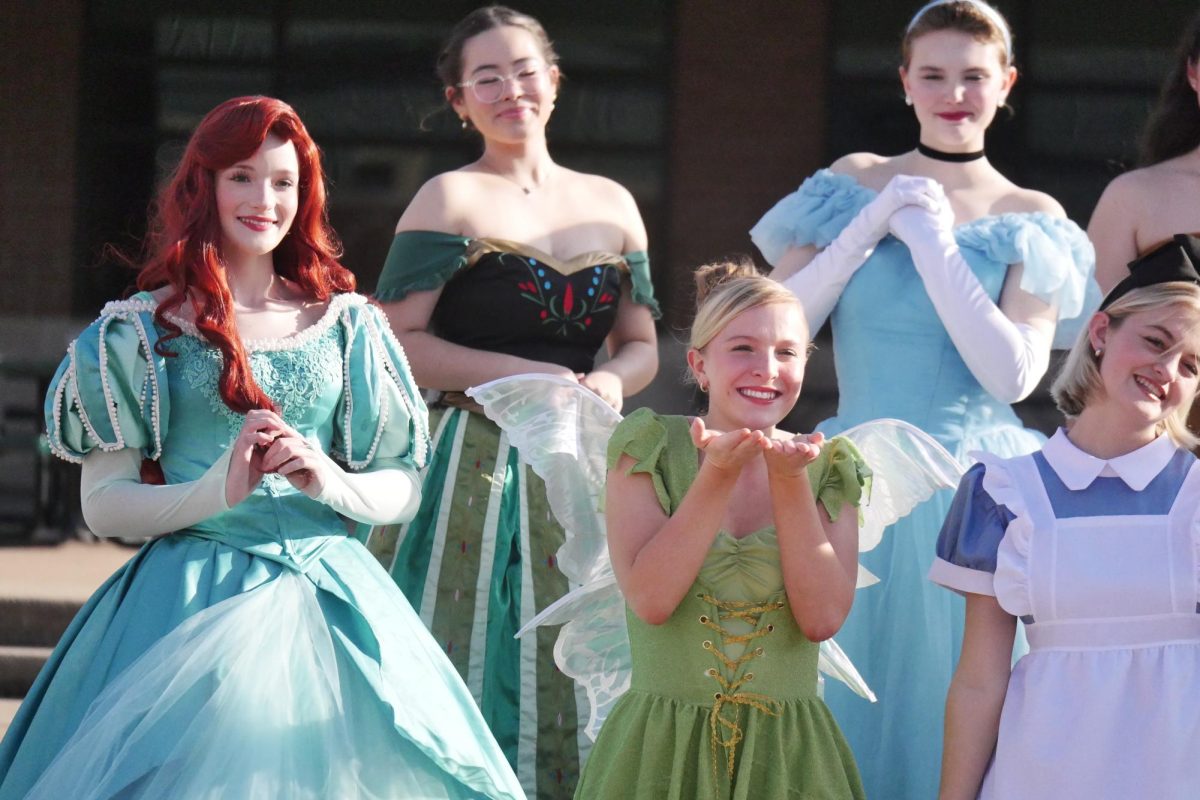 Striking various animated poses, junior Zoey Bramwell, senior Charlotte Griffin, junior Caitlyn Peconga, junior Olivia Common and sophomore Gwen Porter participate in a promotional photoshoot for their upcoming Princess Tea performances with the Seasons a cappella group. Princess Tea is an audience interaction-heavy show that transports younger audiences into a world of princess magic, dancing and singing, through a tea party. “I feel like so many little girls grew up and dreamed of being a princess, so it’s so fun to not only fulfill that childhood wish, but to also become an inspiration for so many young viewers,” Griffin said. “It’s really heartwarming to get to see the pure joy on their faces and know that you’re a part of it.”