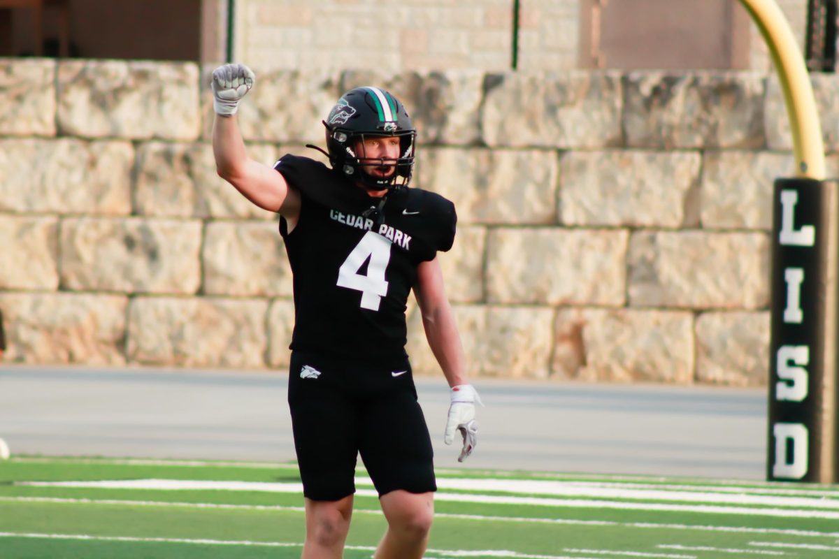 Pumping a fist in the air, senior linebacker Bennett Patton celebrates a successful defensive stop against Harker Heights.