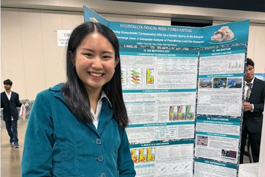 Posing for a picture, senior Kaitlyn Tran stands by her research project at the Greater Austin Regional Science and Engineering Fair. The fair took place at the Palmer Events Center. “[The festival] was really fun,” Tran said. “I loved just talking with real scientists and real professionals. The fact they were curious about what I was doing, even though I was a high schooler, was just so much fun. I look forward to more experiences like that.” Photo courtesy of Kaitlyn Tran