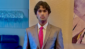 With his hands in his pockets, senior valedictorian Arjun Ram poses for a picture in his suit. Ram set out to be a well-rounded and high achieving individual, which is clear to see. He took numerous AP classes, participated in different clubs and honor societies, and even founded his own club. “In high school, curiosity drove me,” Ram said. “I always wanted to understand more and think deeper.” Photo courtesy of Arjun Ram
