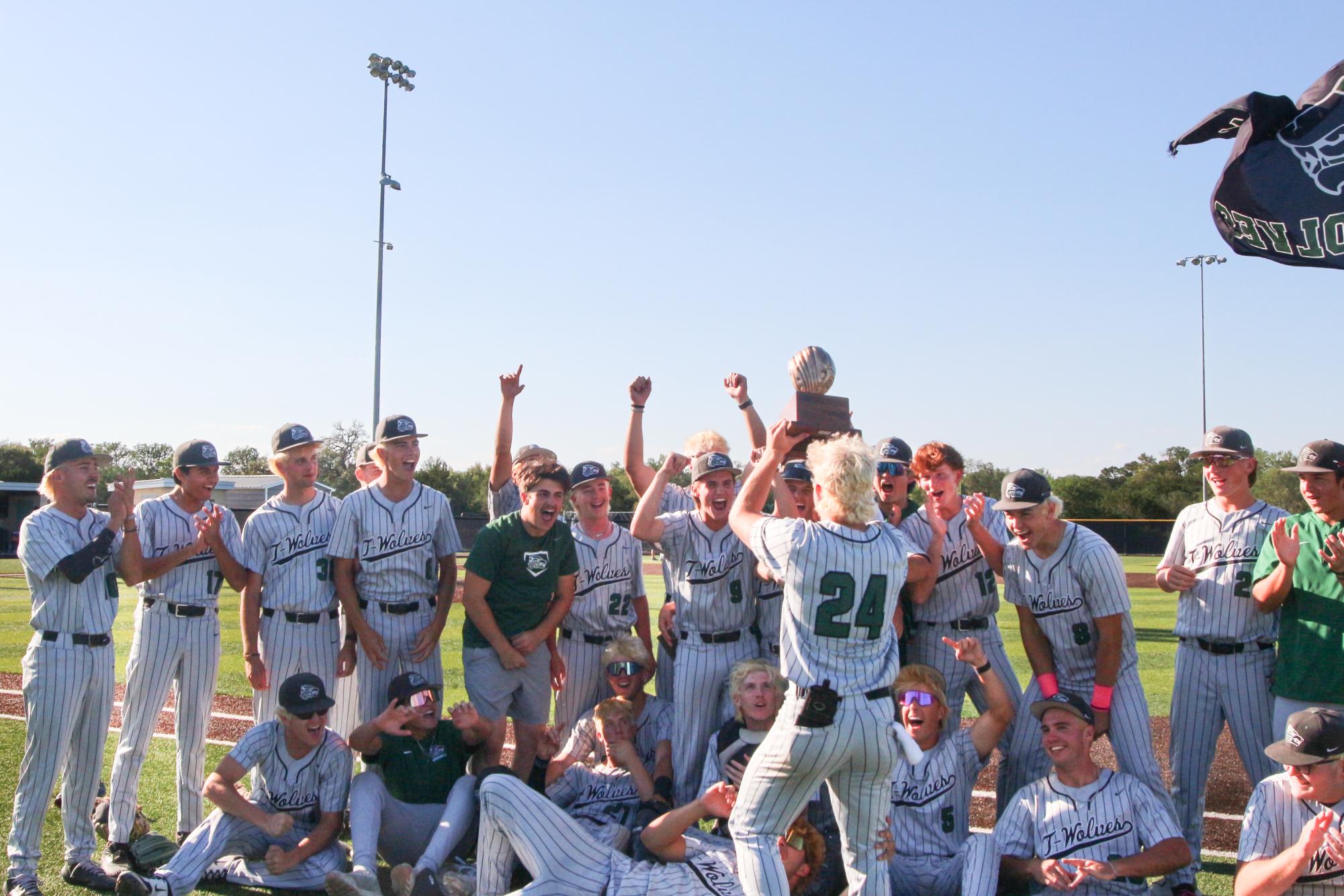 Holding up the bi-district champions trophy, junior shortstop Hudson Cuevas cheers alongside his team. The varsity baseball team played in the bi-district round of playoffs against the Boerne Greyhounds April 30-May 2, where they won Game 1 6-4, lost Game 2 2-1 and won the last game 5-2, allowing them to advance to area. “Honestly, [my favorite] big moment that wasn't even part of my moment was Dom's grand slam,” Cuevas said. “That was a big game changer in Game 1 of round one that ultimately helped us win that game and even move on. It set the tone for the games after and has really impacted and sparked this whole playoff run.” Photo by Allie Tseng